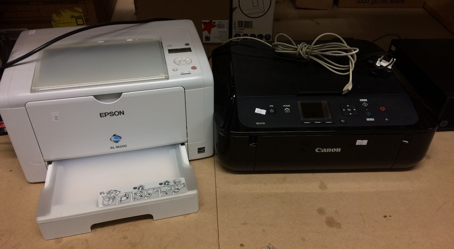 A Canon MG5750 scanner/printer and an Epson AL-M200 printer