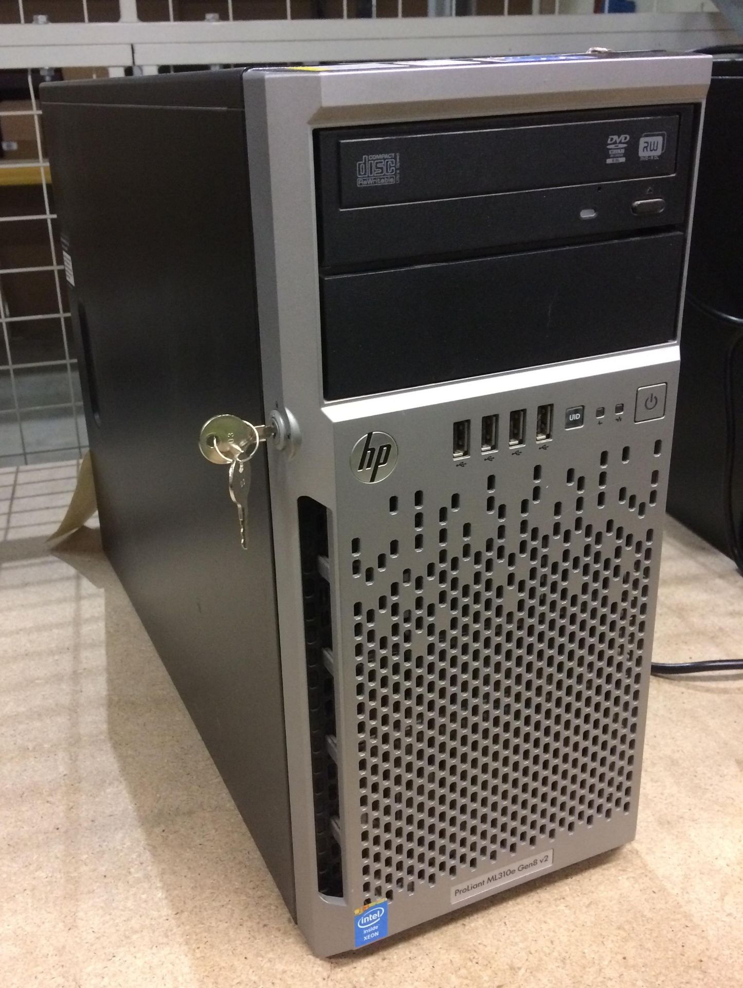 An HP Proliant ML310e Gen 8V2 tower computer complete with lead