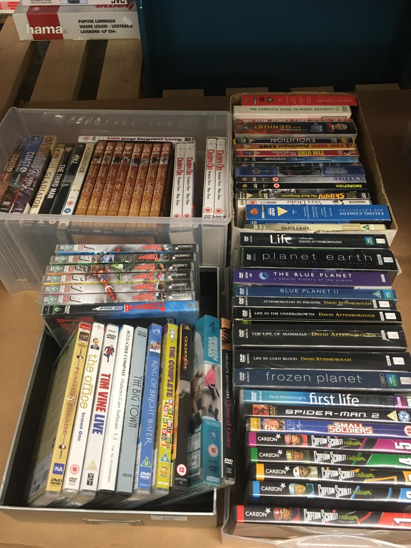 Contents to 4 x boxes and trays - 60 x items - DVDs and DVD box sets (classification U - 15) -