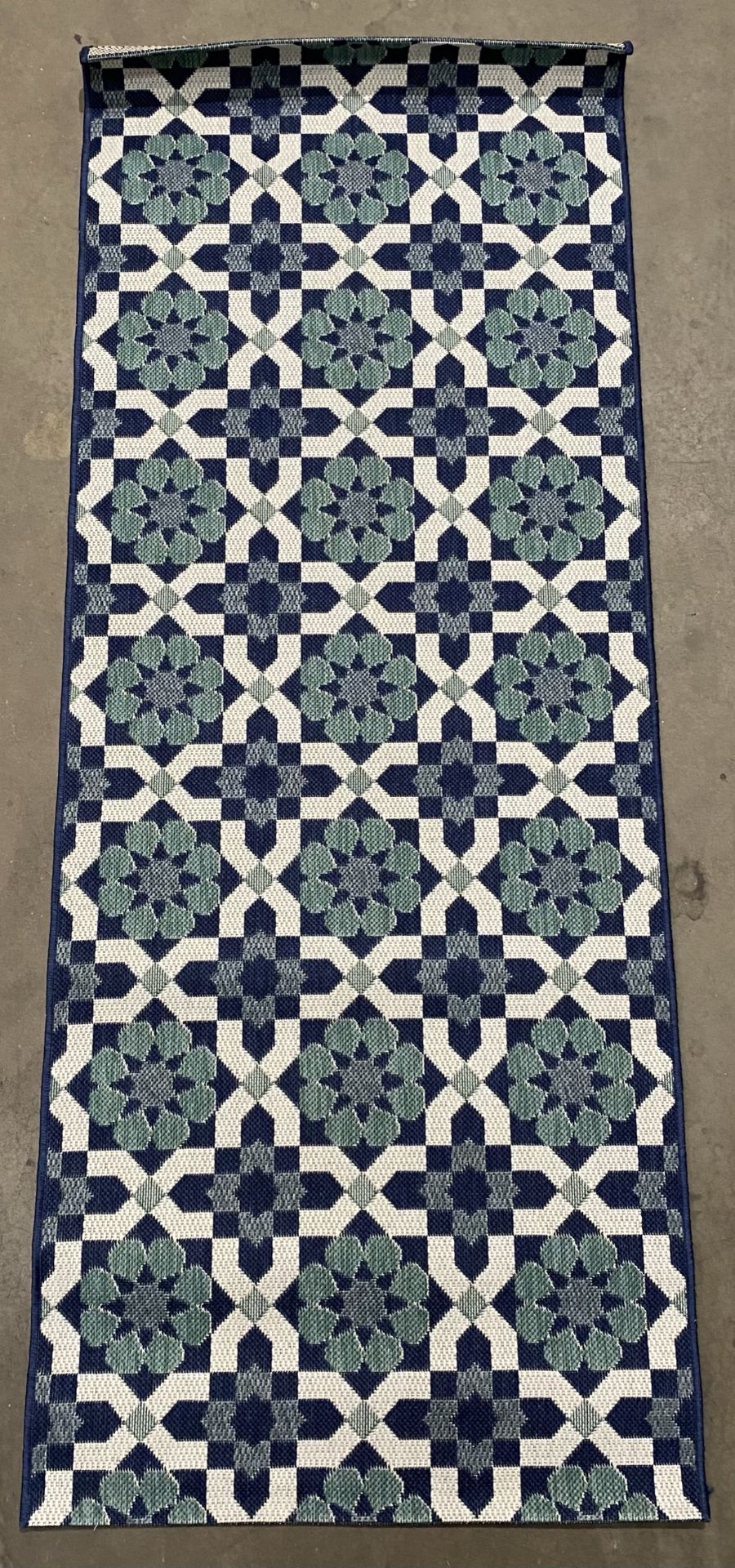 Blue and white patterned rug,