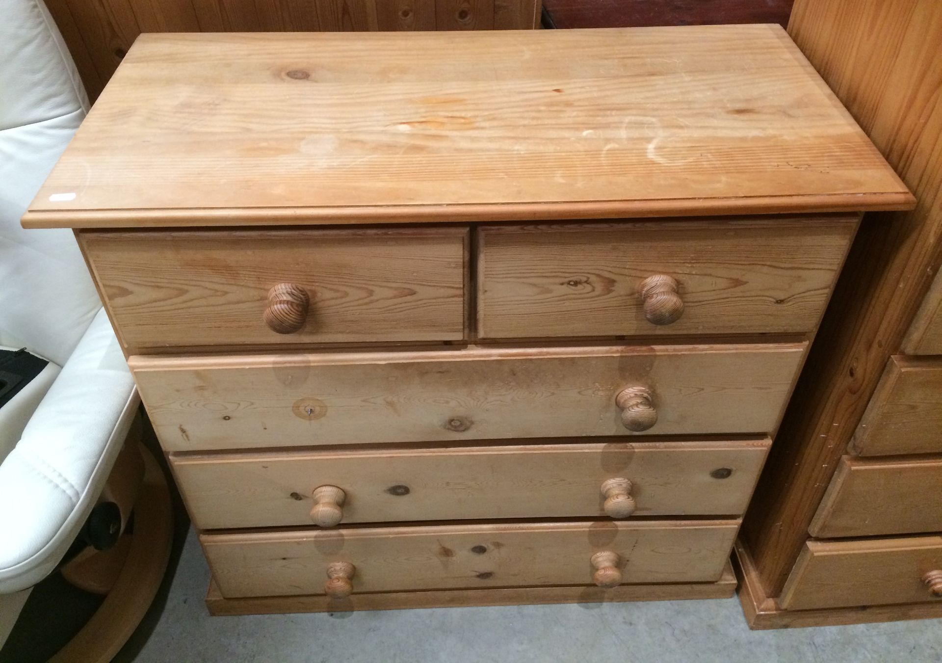 A pine five drawer (two short and three long) chest of drawers,