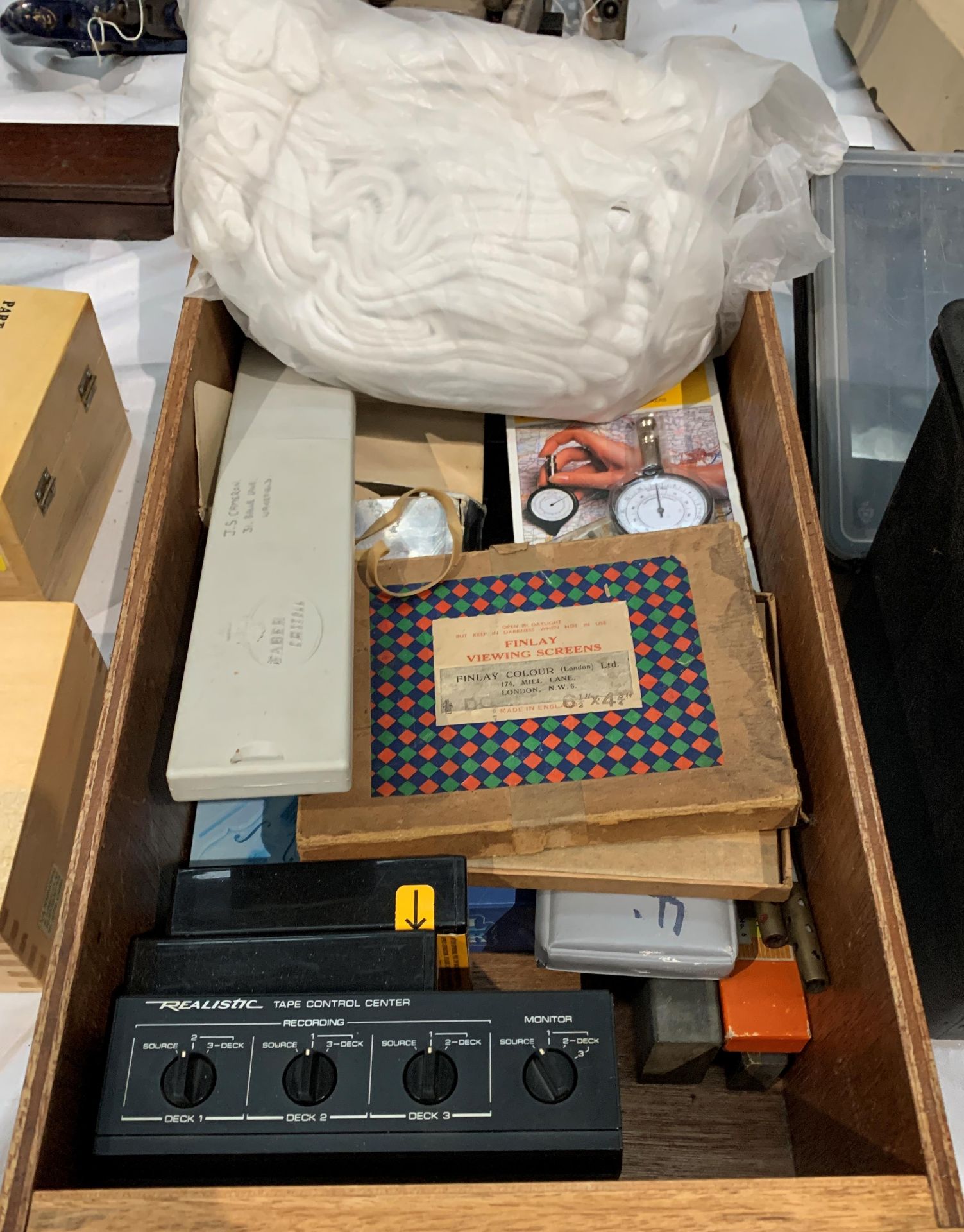 A wood drawer containing an MP3 digital music player, QED tape switching unit,