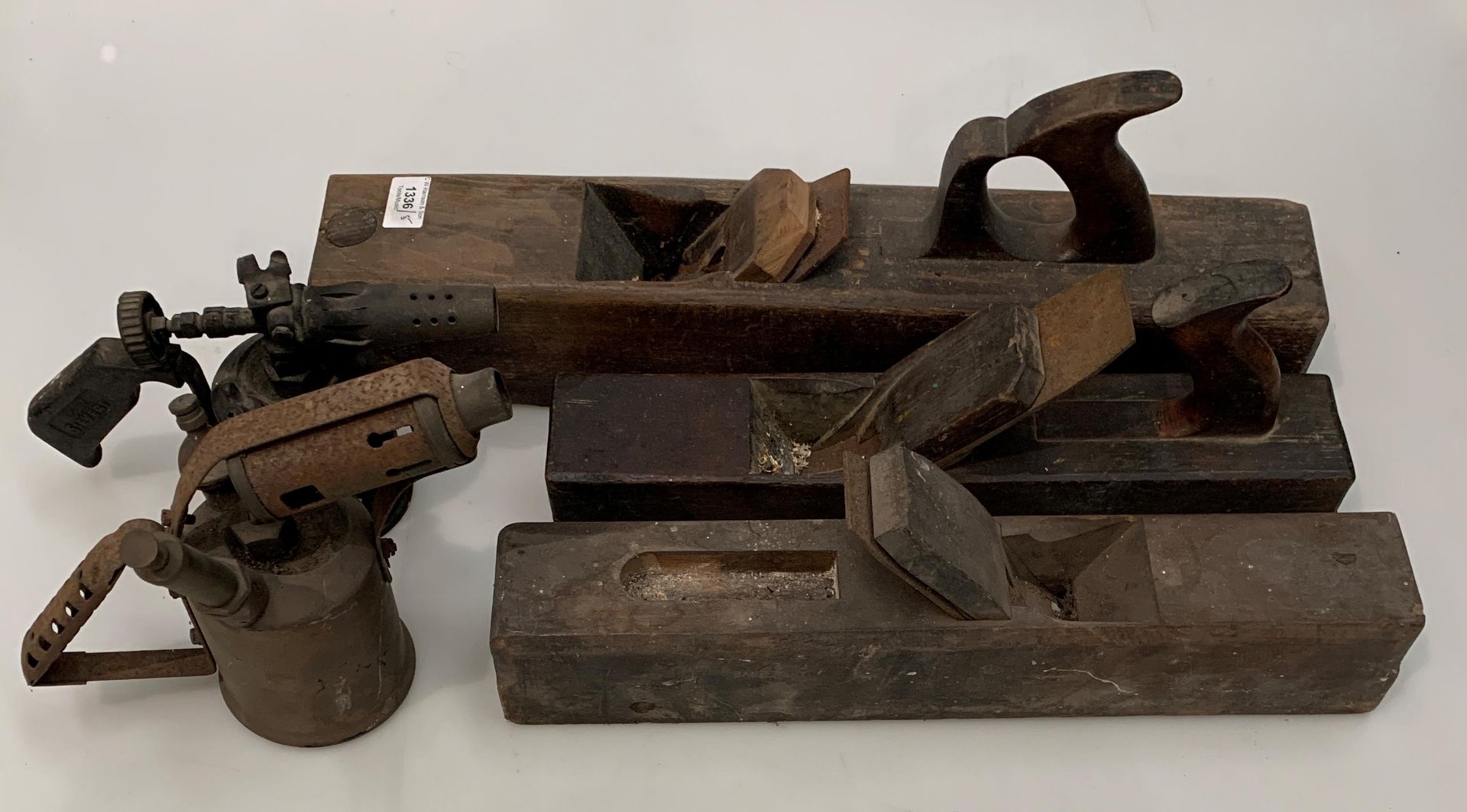 Three wood block/jointing planes and two metal blow torches