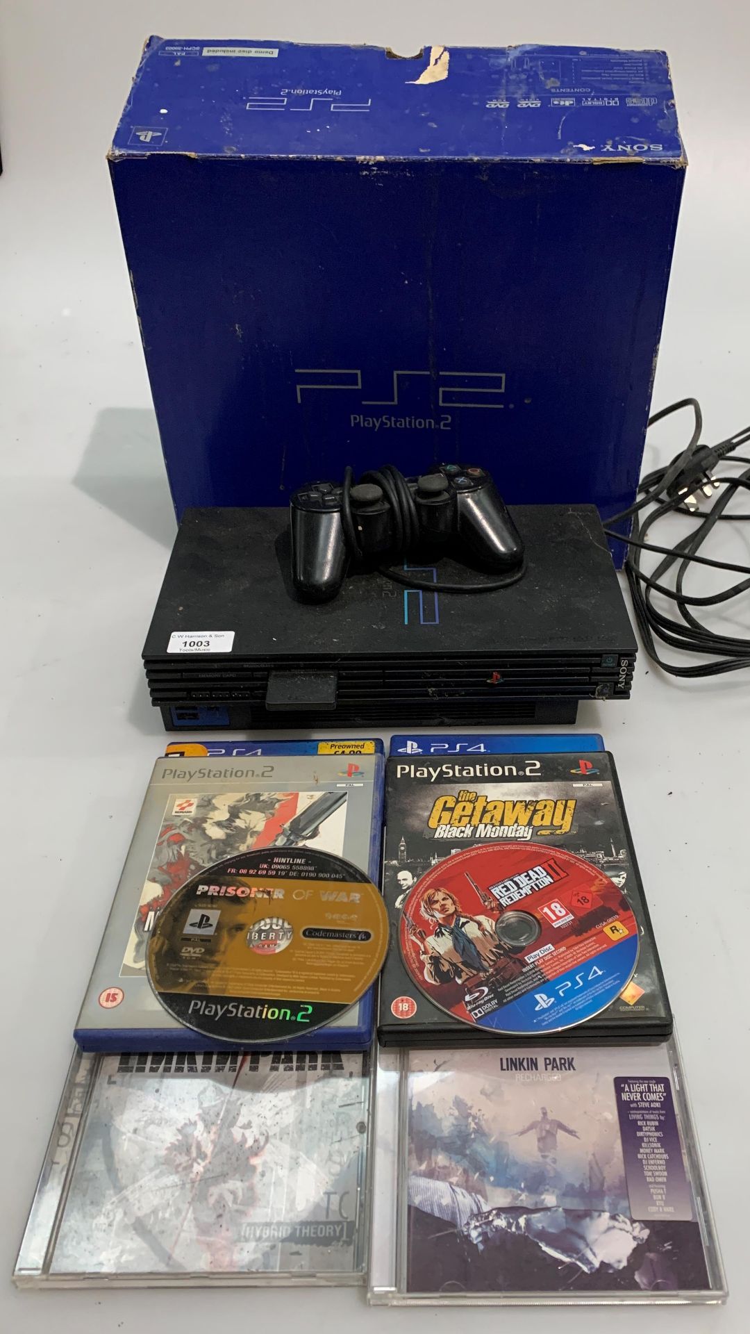 A Sony PlayStation 2 - one controller, three PS2 games (one unboxed,