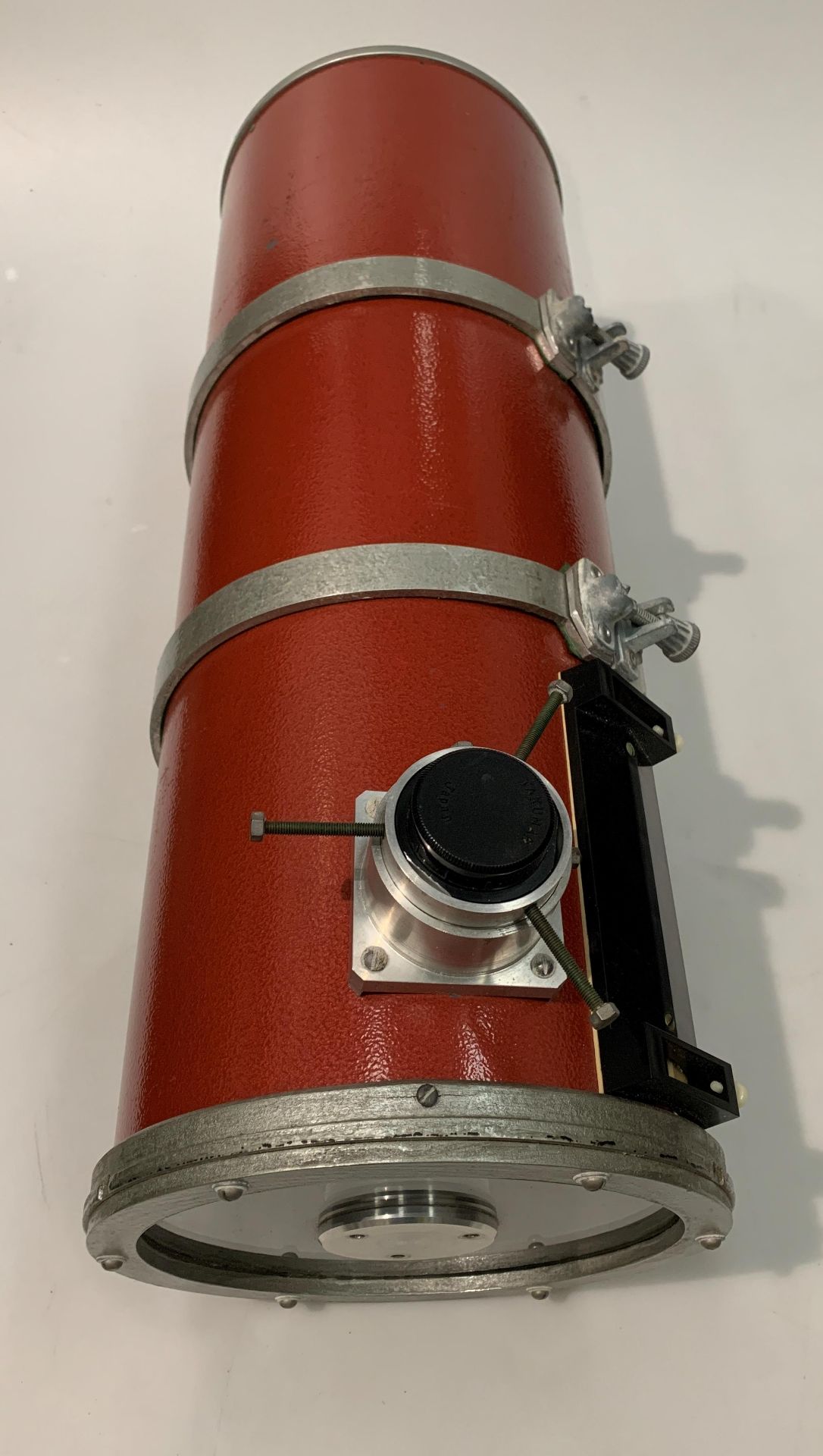 A large telescope, 25cm diameter x 68cm long, in grey wooden storage box.