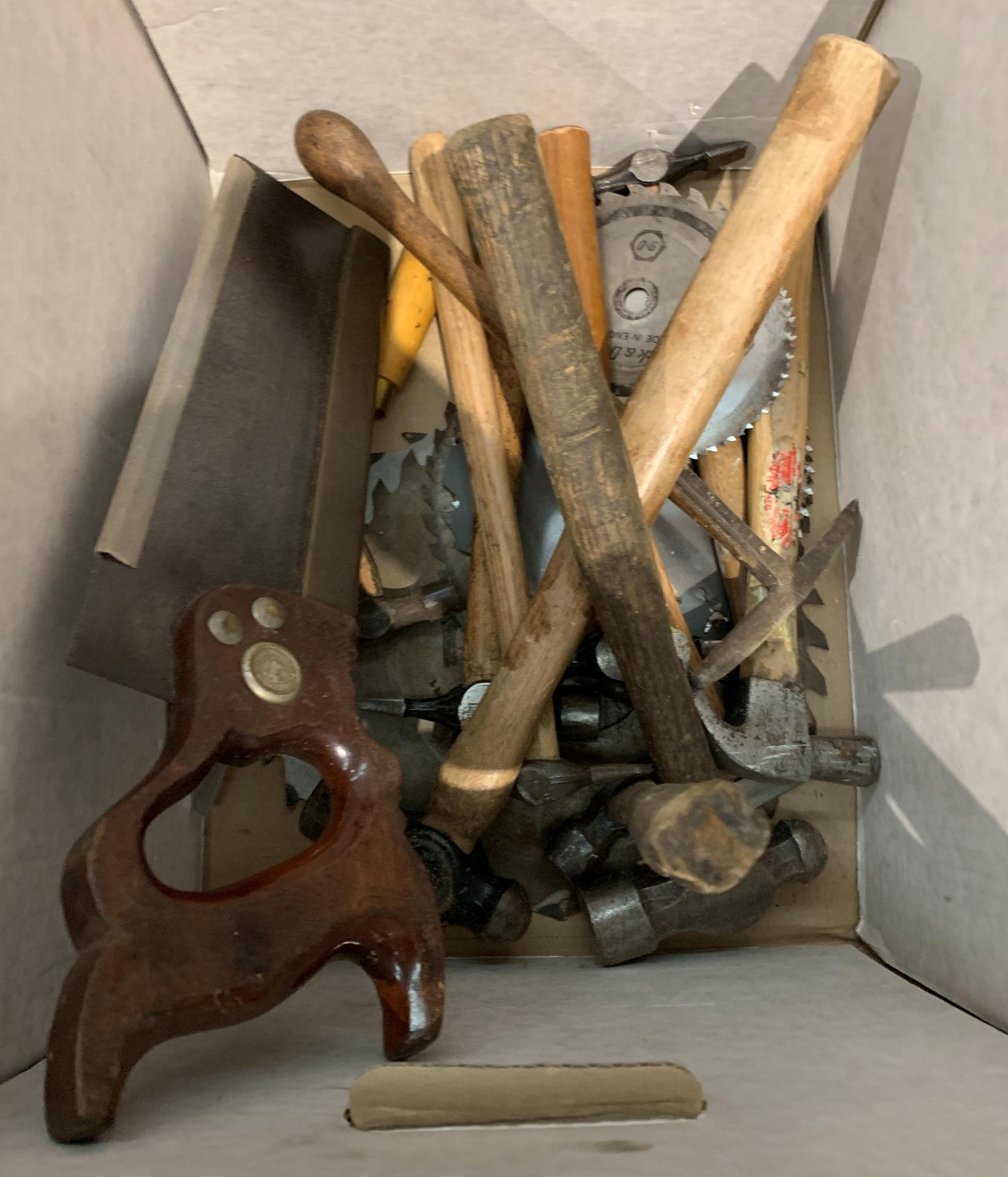 Contents to box - hammers, saw,