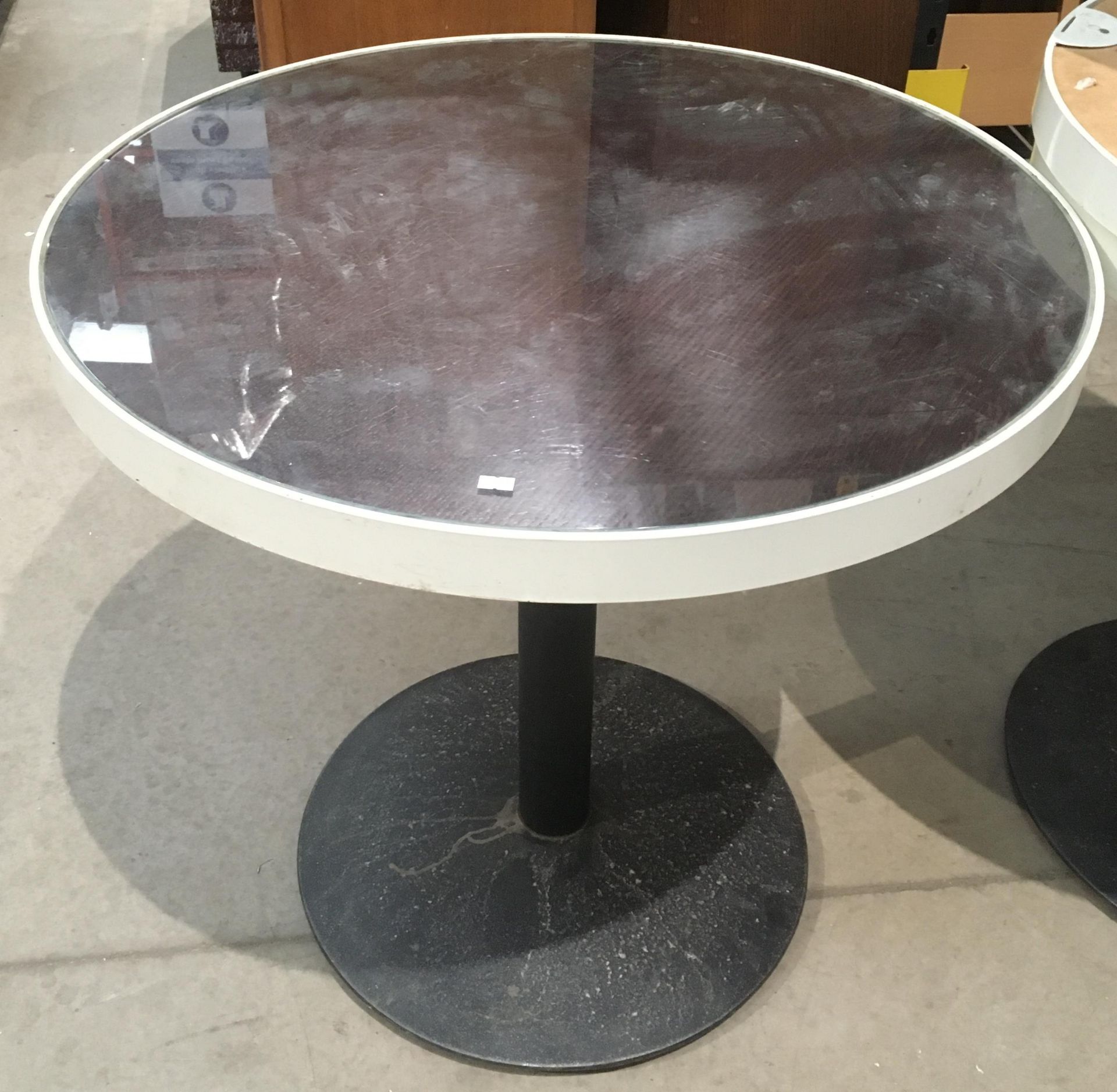 Glass topped circular table 81.