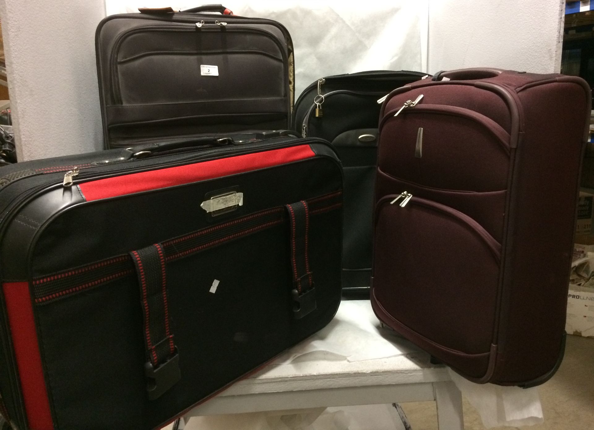 4 x assorted suitcases - 2 x large and 2 x medium