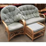 A bamboo framed three piece conservatory suite comprising two seater settee,