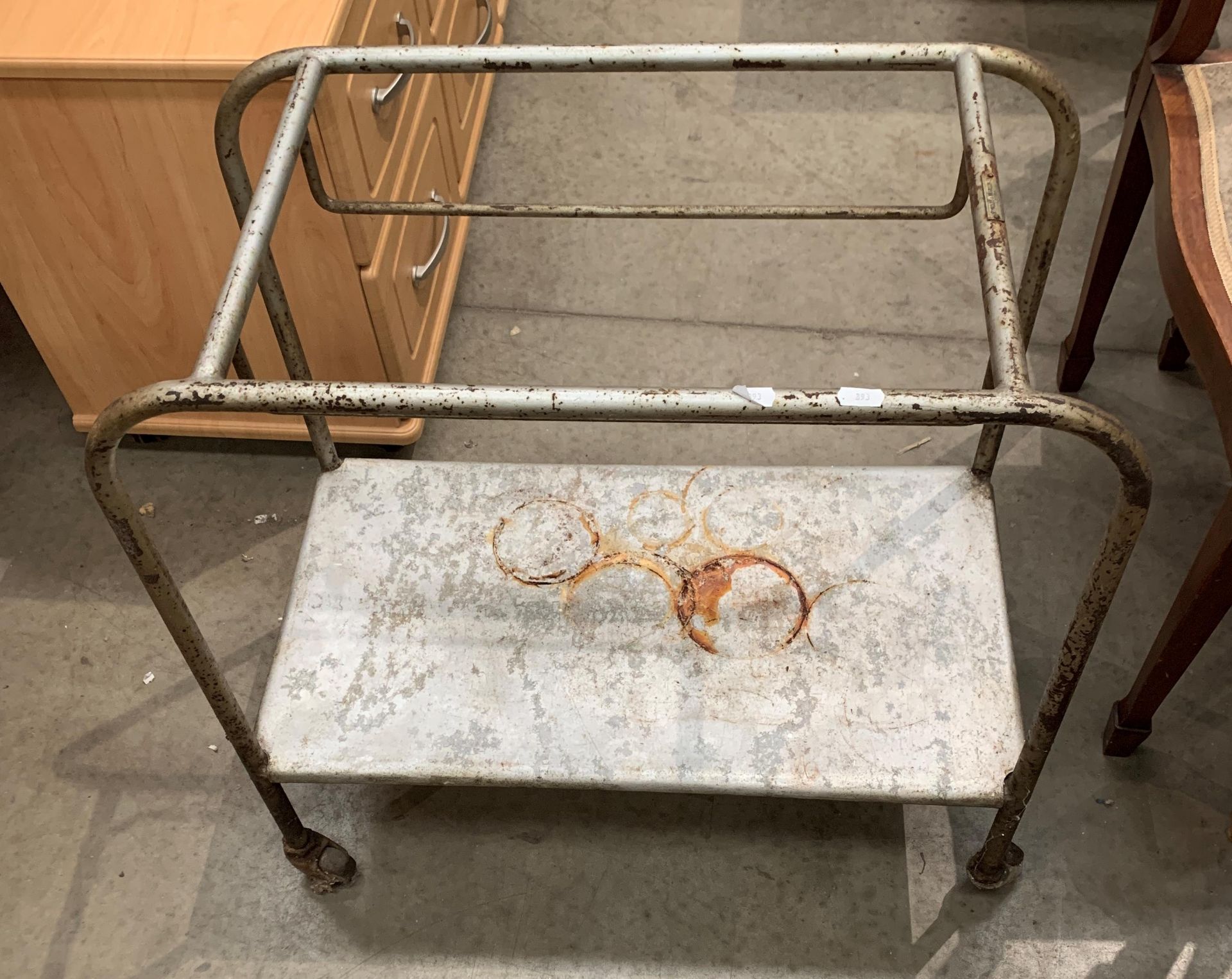 A tubular metal trolley with under tray (no top tray)