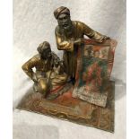 Cold painted bronze figure, in the style of Bergman, The Carpet Seller, base size 17cm x 12cm,