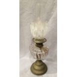 A brass and glass oil lamp with etched glass shade and funnel,