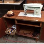 A Singer 527 240v sewing machine in teak cabinet