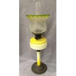 A brass and yellow and cream glass oil lamp with etched glass shade and funnel,