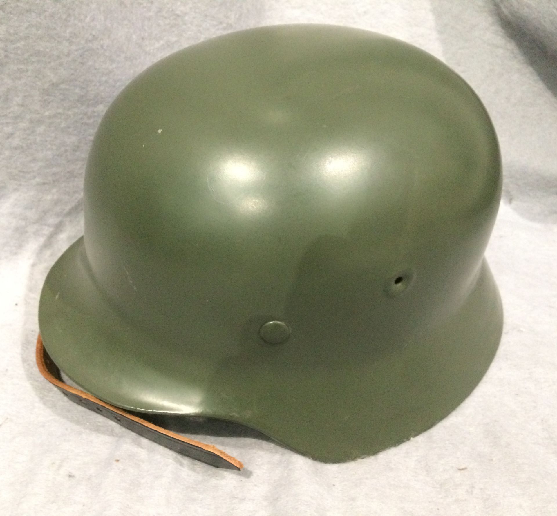 A reproduction green metal 'German' mili