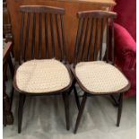 A pair of stick back dining chairs