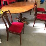 An oak oval extending dining table 118 x 160cm when extended on a bulbous single column 4 feet base