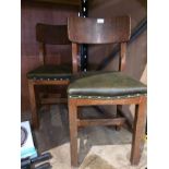 Pair of oak school chairs with green vin