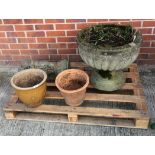 A large weathered concrete composition garden planter 54cm dia and 48cm high,
