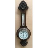 An oak cased aneroid barometer, 83cm lon