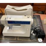 A Janome New World 240v portable sewing machine, model no JB1408, serial no.