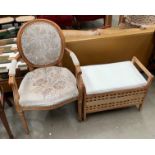 A continental style open elbow armchair with beige floral patterned upholstery [Please note - the