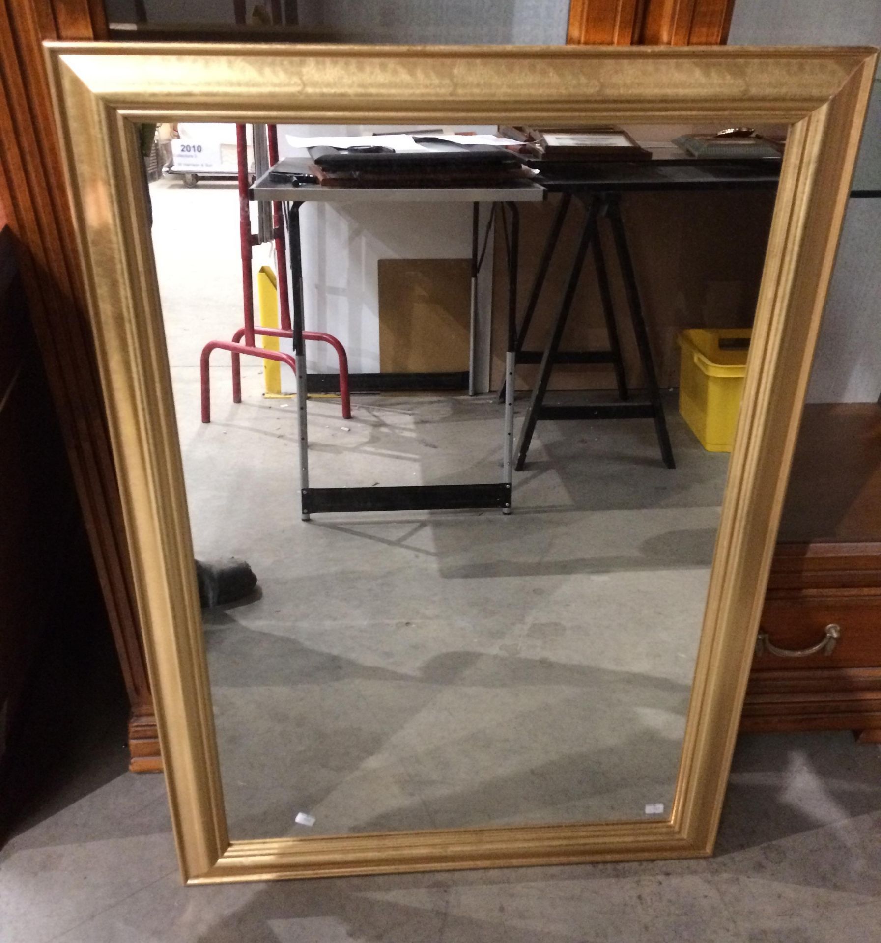 A Jazz gold coloured framed wall mirror,