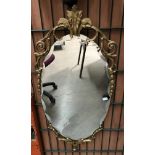 Gilt framed oval wall mirror, 90cm x 38c