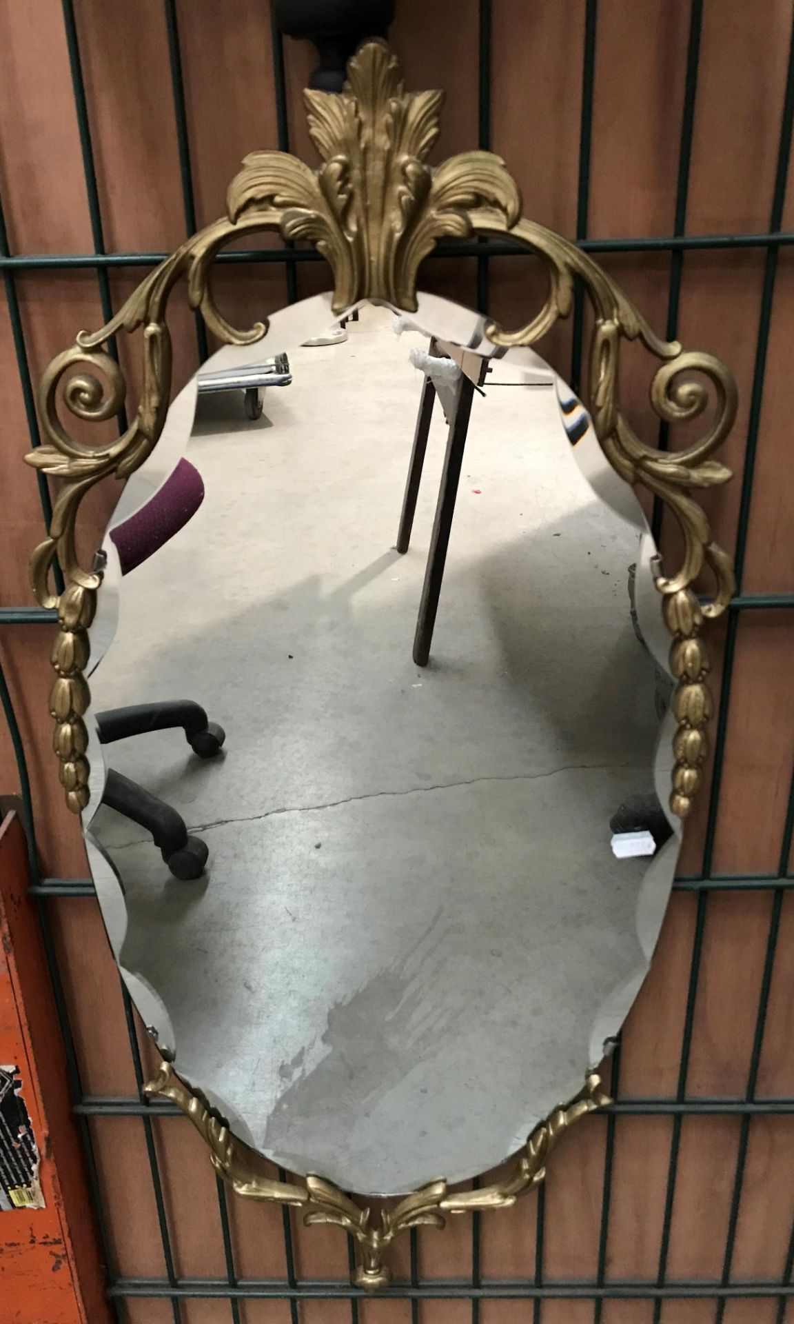 Gilt framed oval wall mirror, 90cm x 38c