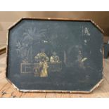A chinoiserie style ebonised tripod table with octagonal shaped top,