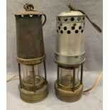 Two brass and metal miner's lamps, each approximately 27cm high,