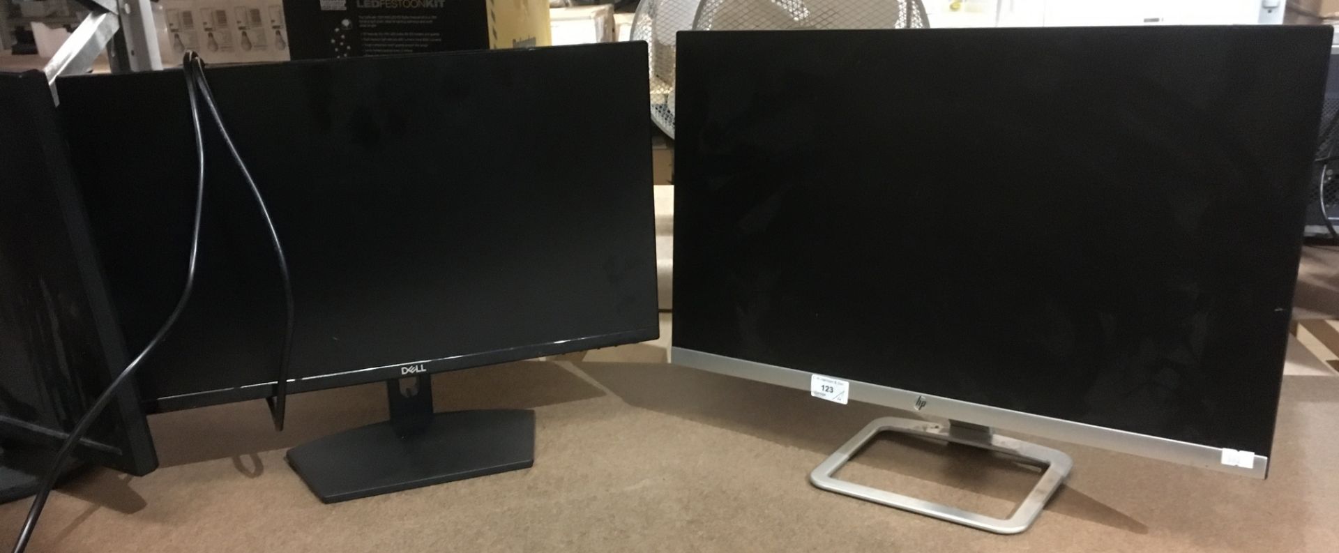An HP 24EA - 23 - 8 display monitor and three other monitors by Dell (19"),