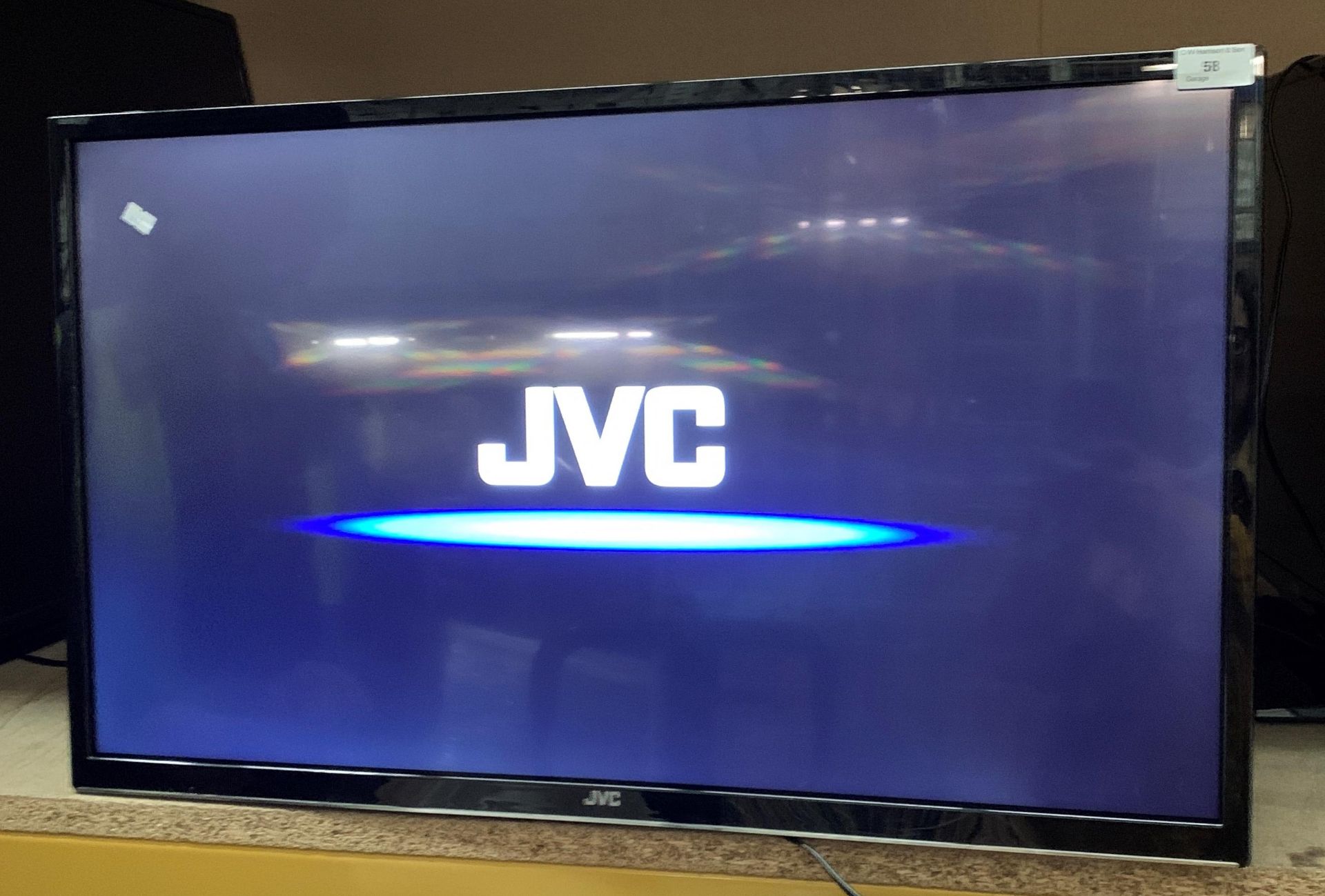 A JVC LT-32C670(C) 32" wall mounting LED Smart TV complete with remote control