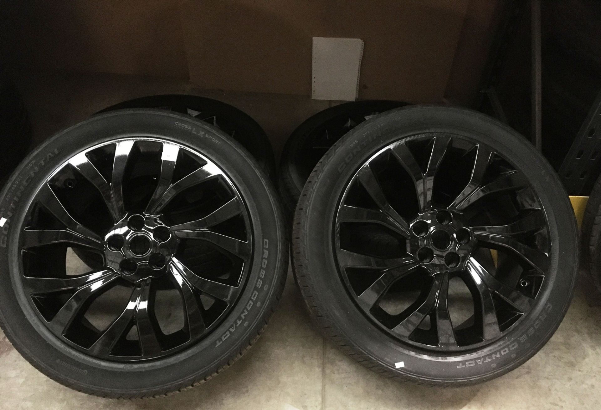 Four black alloy wheels (slight use) fitted with four Continental cross contact LS Sport 275/45 R21