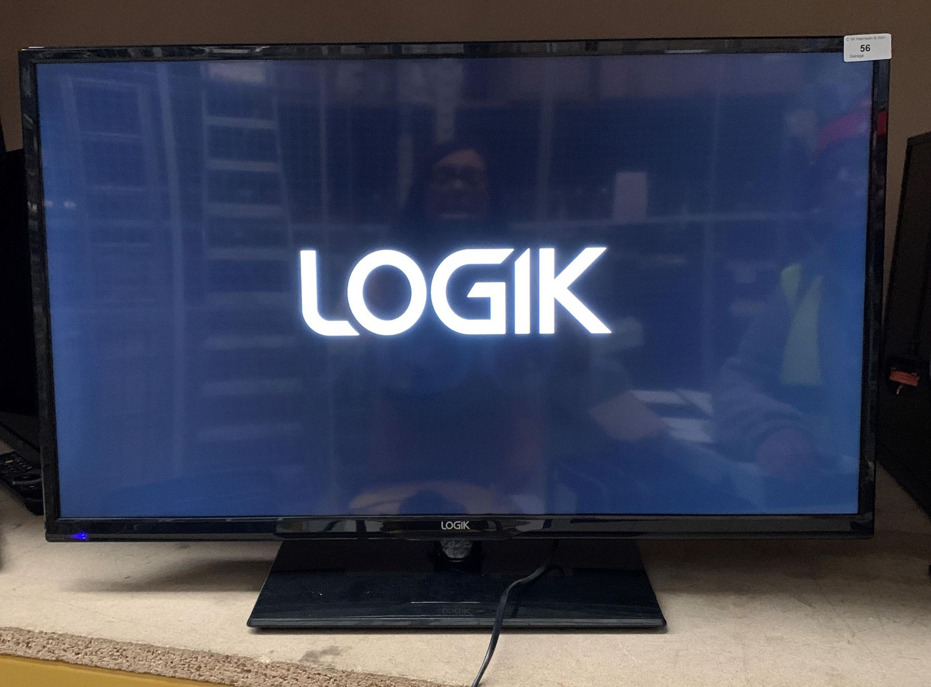 A Logik L32HE18 32" HD LED backlit LCD TV complete with remote control and stand