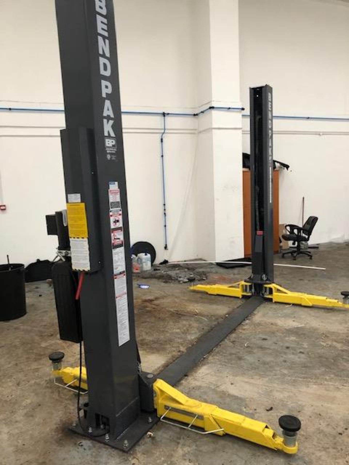 A BENDPAK XPR-9TS 9000lb/4082kg capacity two post wheel free vehicle lift - 3 phase Date of MFG :