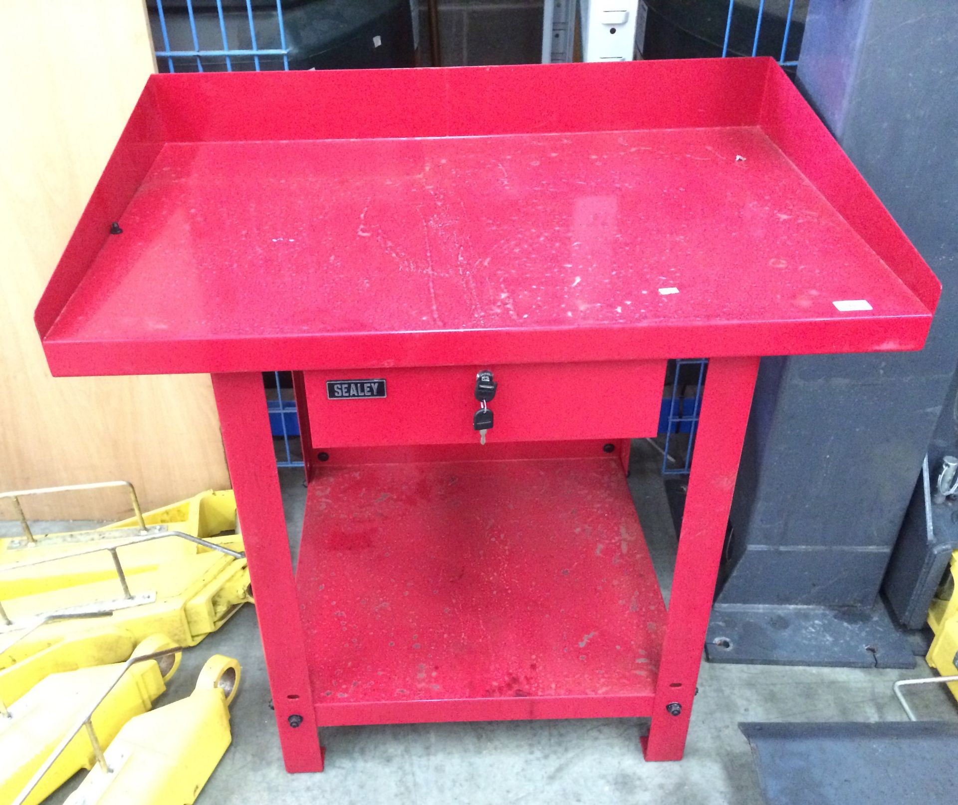 A Sealey red metal single drawer (two keys) workshop bench 100 x 66 x 87cm high