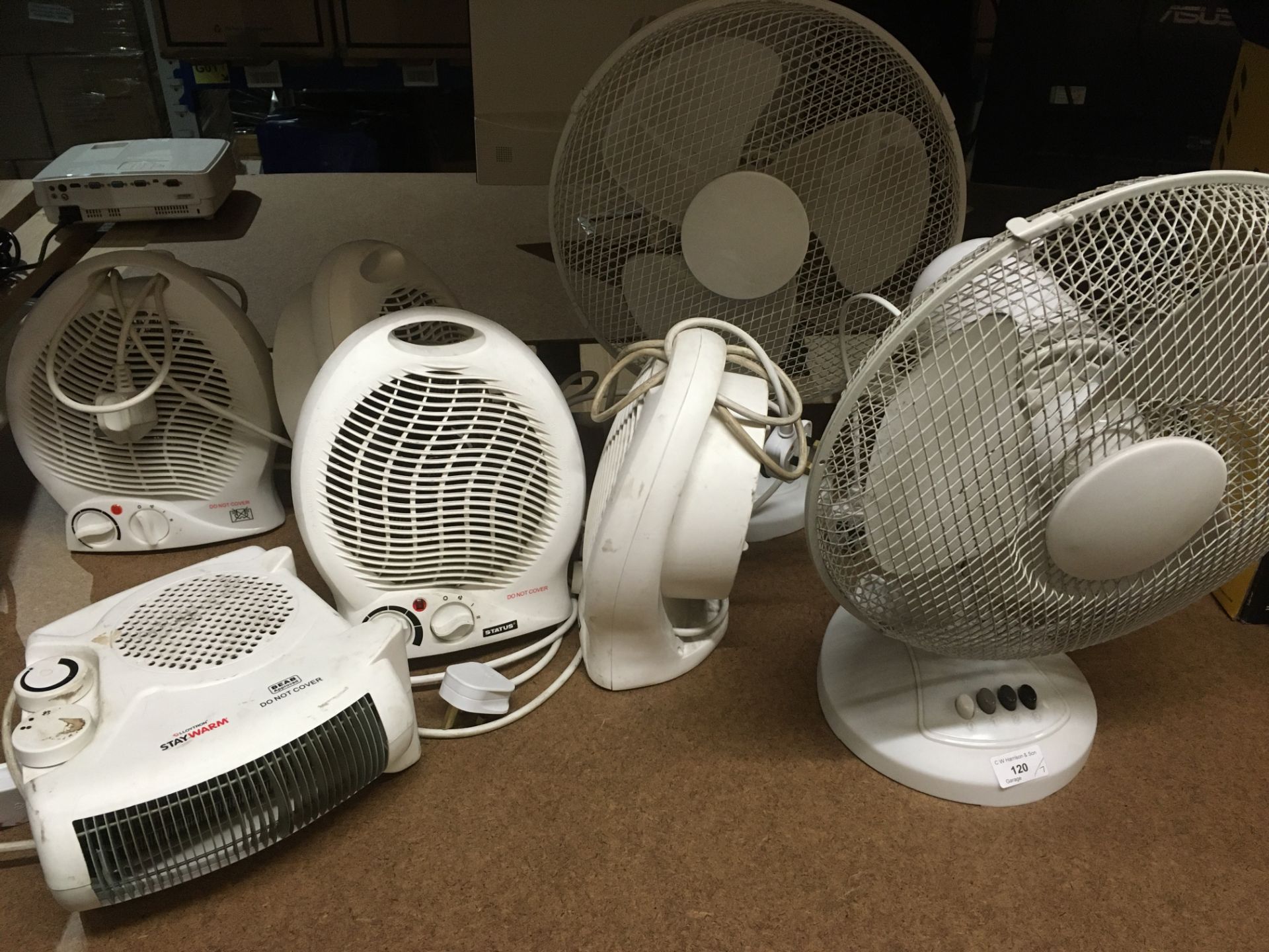 Two table top oscillating fans and five small 240v electric heaters (7)