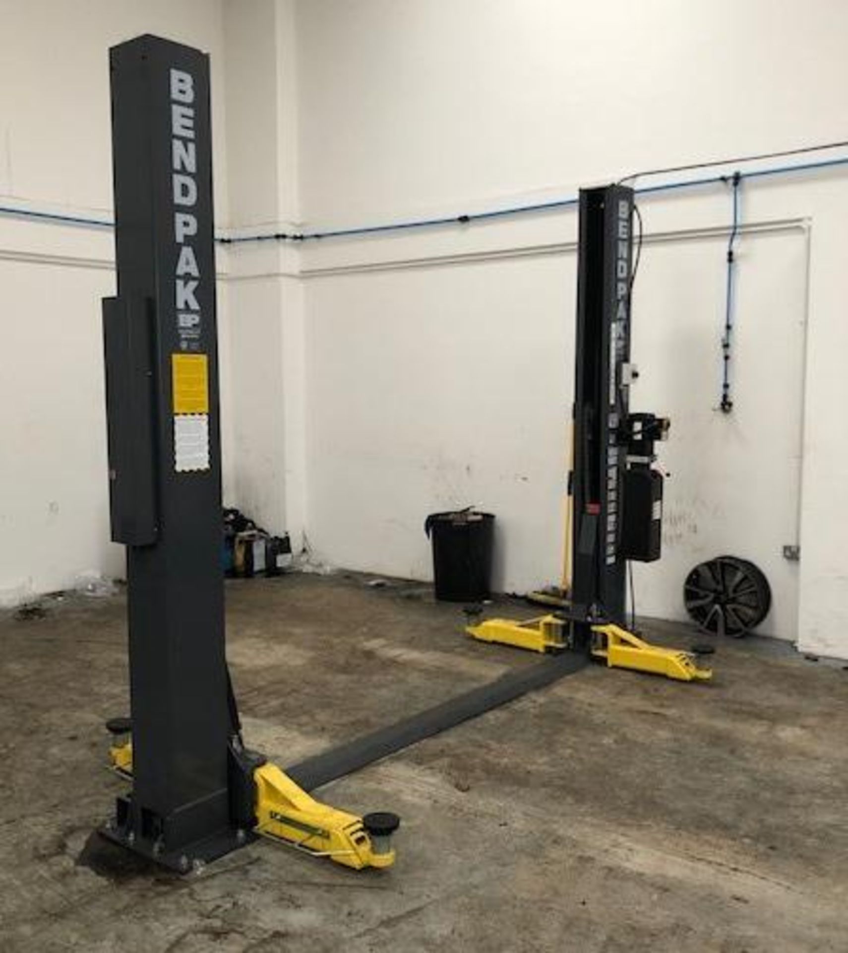 A BENDPAK XPR-9TS 9000lb/4082kg capacity two post wheel free vehicle lift - 3 phase Date of MFG :