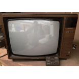 A Grundig Teletext Super Color Series F 3020 vintage 20" colour TV complete with remote control