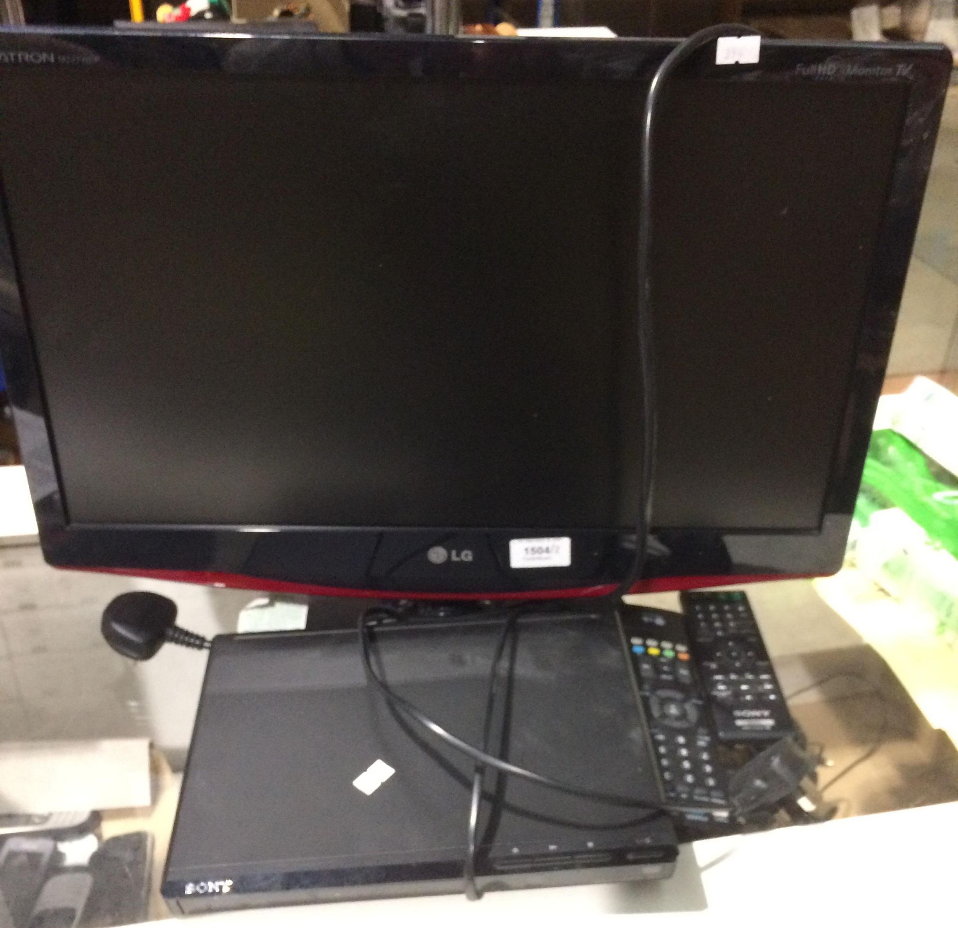 An LG Flatron M227WDL flat screen TV complete with remote control and a Sony DVP-SR170 CD/DVD