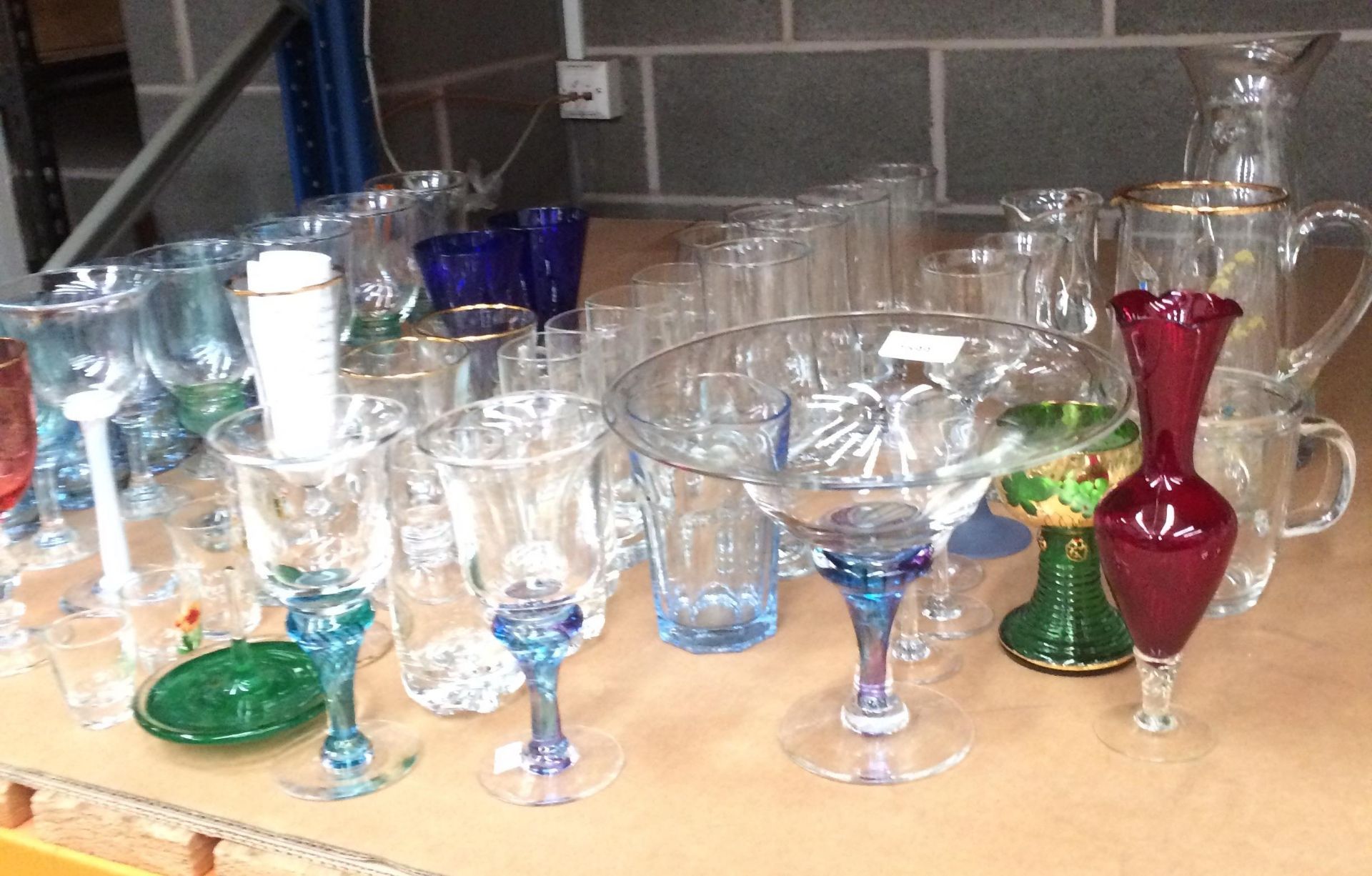 Contents to part of rack - a large collection of glasses and glassware including jugs, bowl,