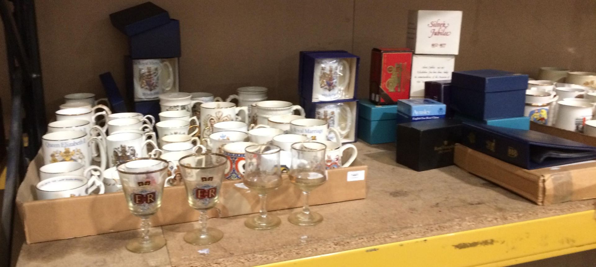 Contents to tray and side of tray - a quantity of pottery and porcelain royal commemorative mugs,