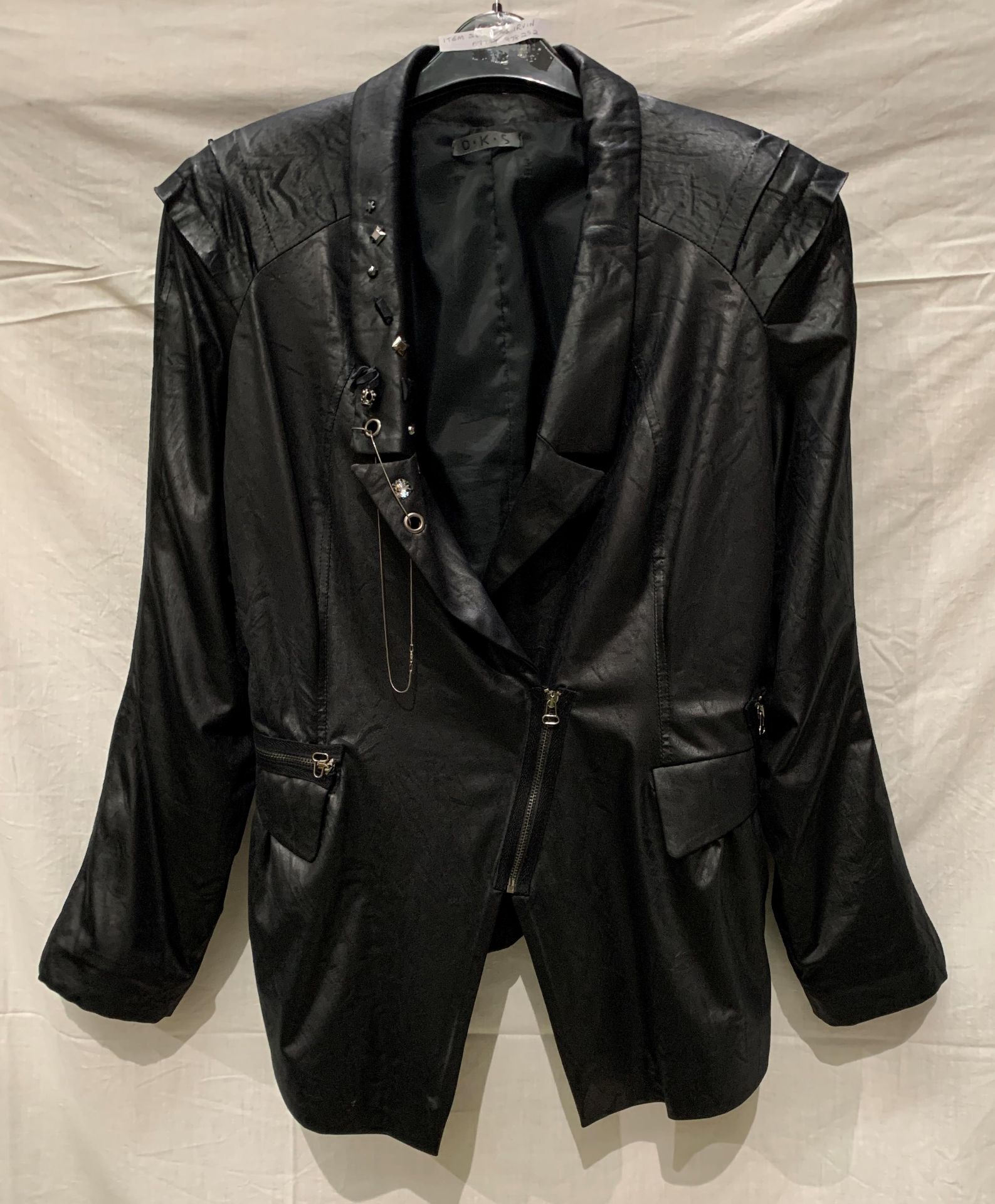 OKS, a black pletha jacket with 'Ming' shoulders, front zip and stud features, fully lined,