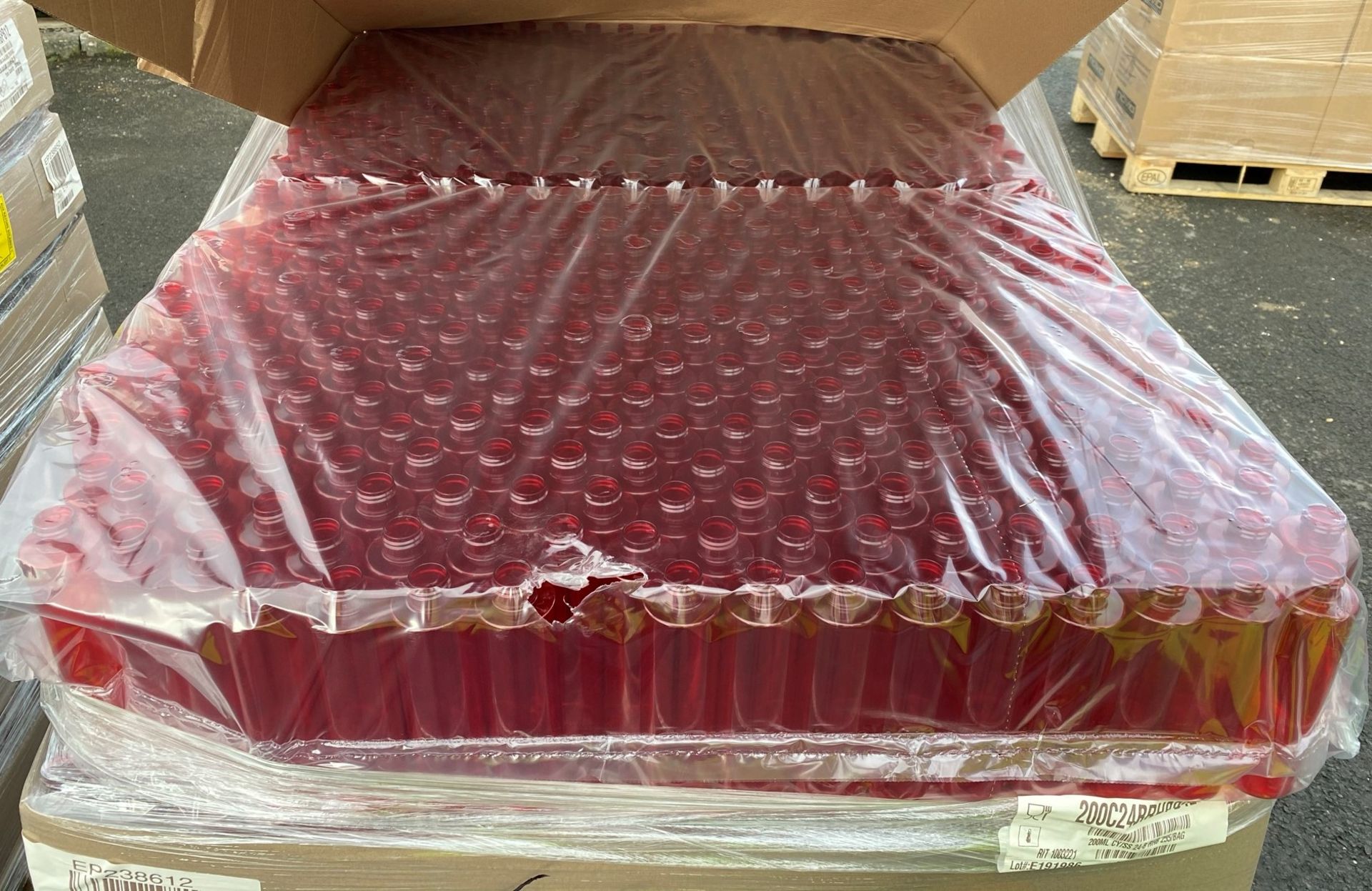 Contents to pallet - Approximately 3,060 x Red plastic cylinderical 200ml bottles - NO LIDS - (Ref. - Image 3 of 5
