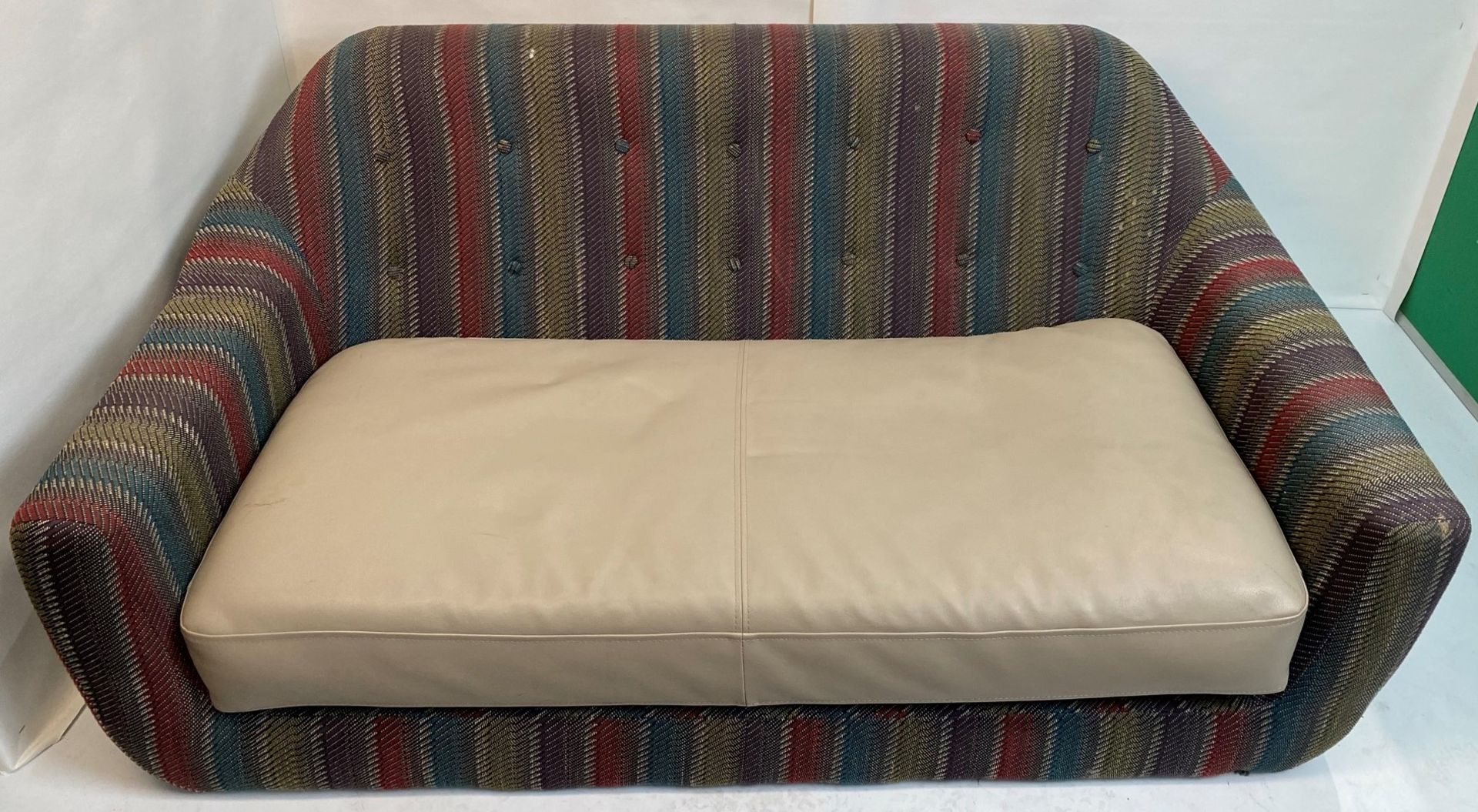 A Multicoloured striped fabric 2 seater sofa on 4 wooden legs