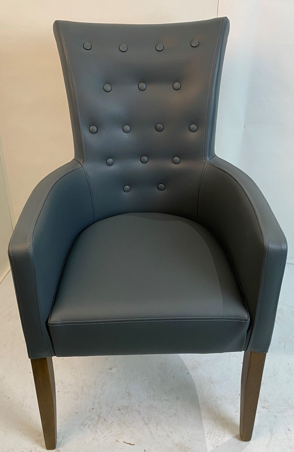 An Omega Vena SA4 Rustikal armchair with button back detail