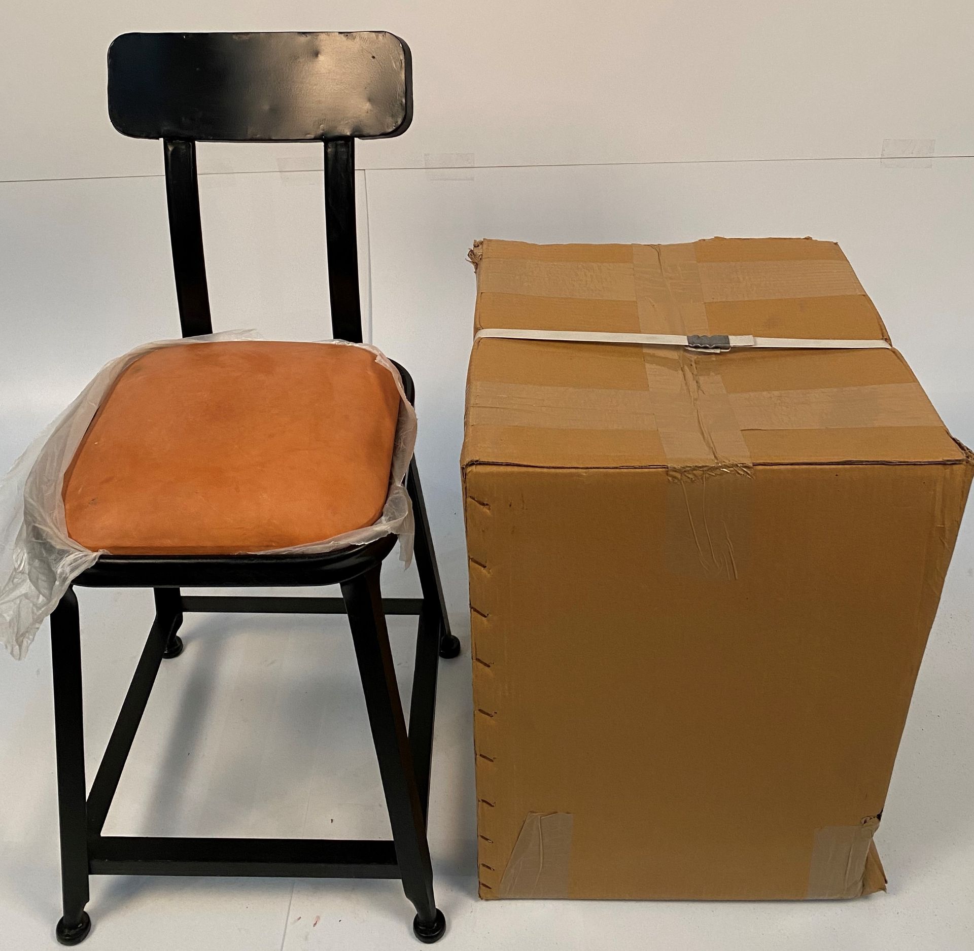 An Industrial UPH low stools with metal back - black metal frames