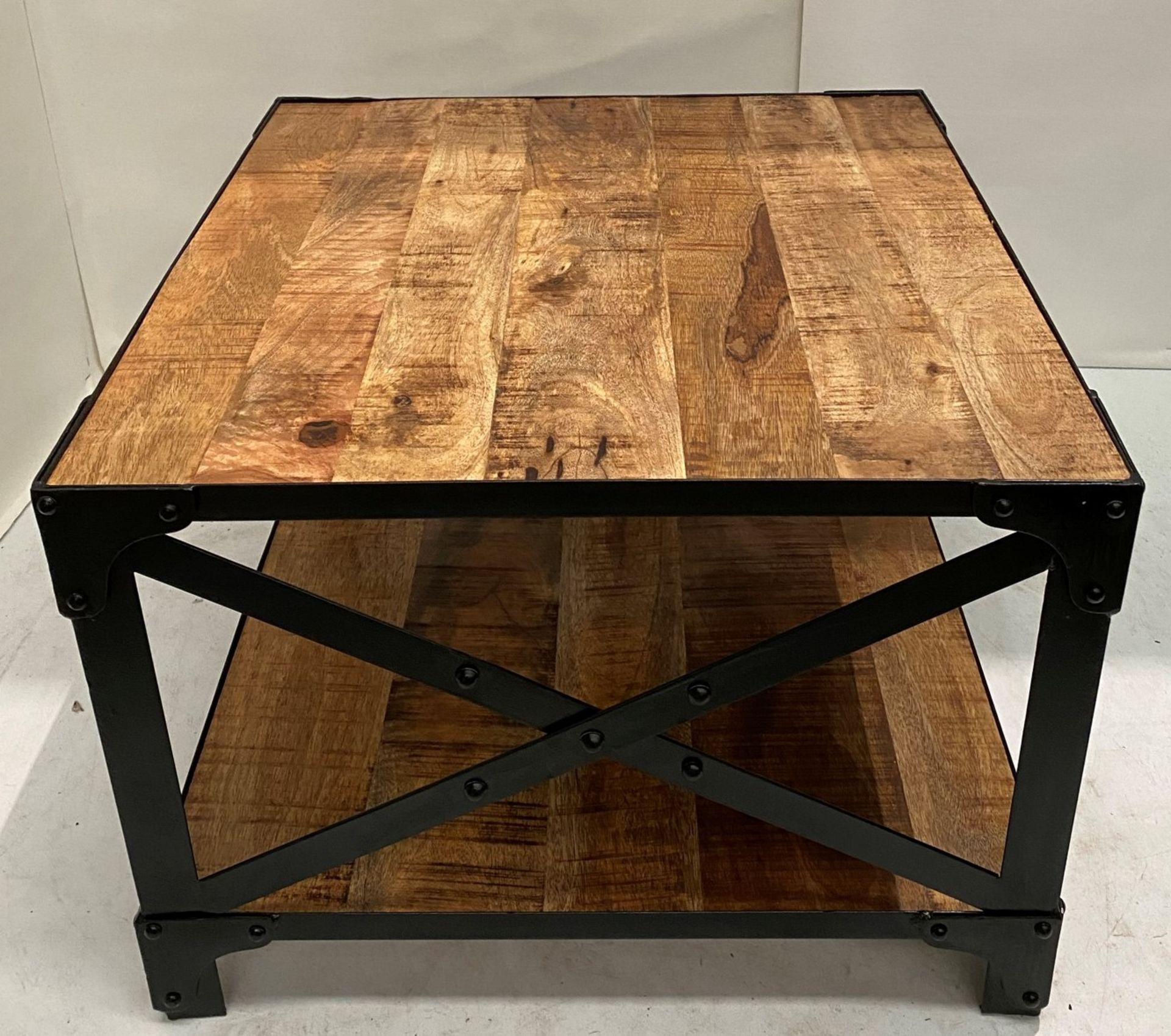 An Industrial coffee table with wooden top and black metal frame - 600mm x 600mm