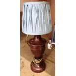 A brown metal urn style table lamp